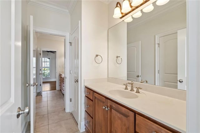 bathroom featuring vanity, crown molding, and tile patterned floors