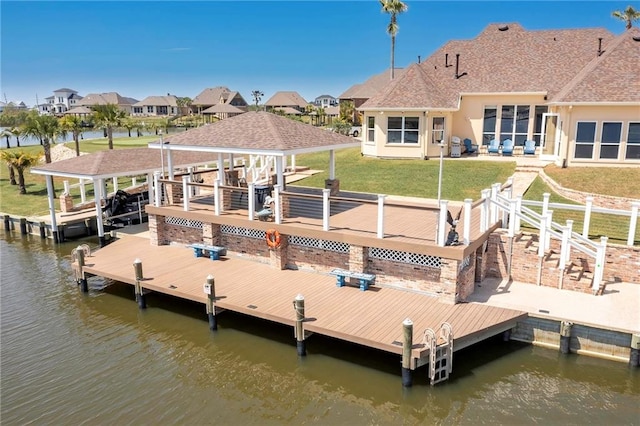 view of dock featuring a yard and a water view