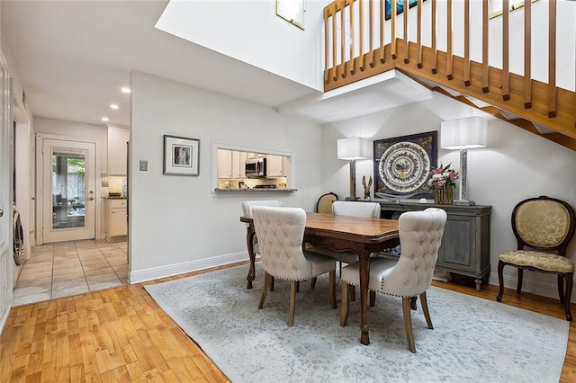 dining space with light hardwood / wood-style floors