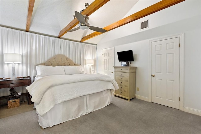 carpeted bedroom featuring ceiling fan and vaulted ceiling with beams