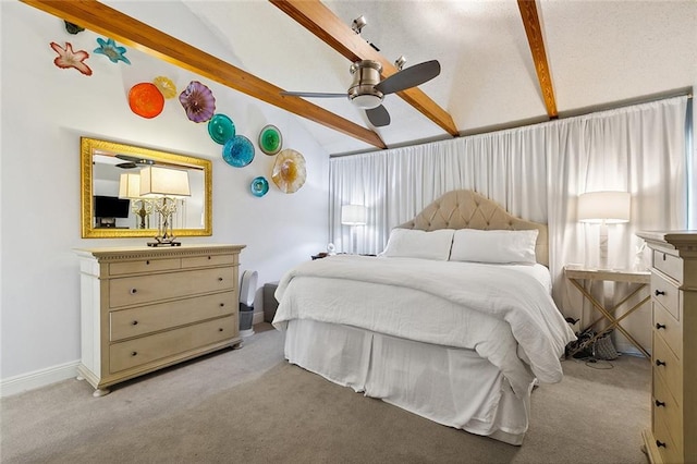 bedroom featuring lofted ceiling with beams, ceiling fan, and light colored carpet