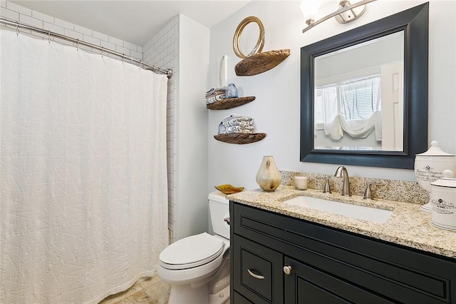 bathroom featuring vanity, tile patterned floors, toilet, and curtained shower