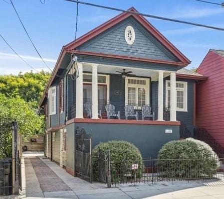 2462 Royal St, New Orleans, LA 70117 - bungalow-style home with ceiling fan and covered porch