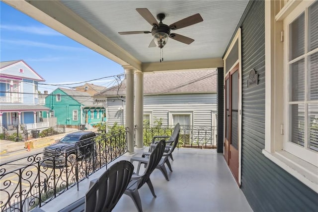 balcony featuring ceiling fan and covered porch