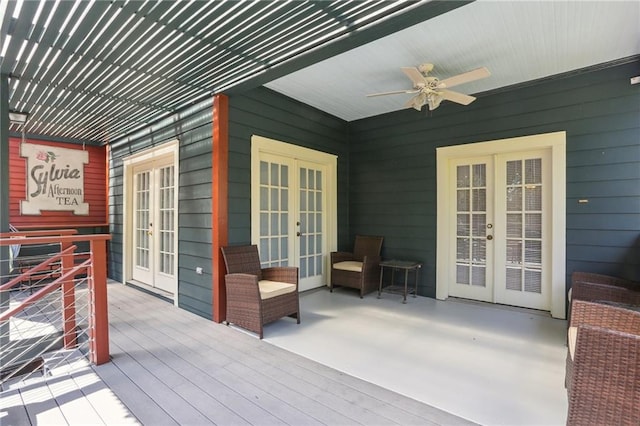 wooden terrace with ceiling fan and french doors