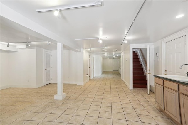 2462 Royal St, New Orleans, LA 70117 - basement featuring light tile patterned floors and sink