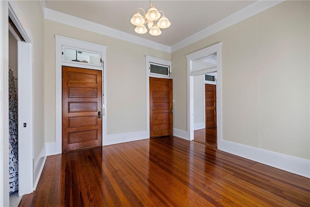 interior space with ornamental molding, dark hardwood / wood-style floors, a closet, and a notable chandelier