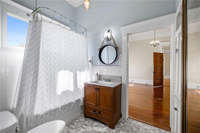 full bathroom featuring vanity, crown molding, toilet, a notable chandelier, and wood-type flooring