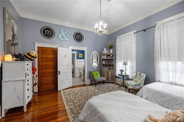 bedroom with dark hardwood / wood-style floors, ornamental molding, and an inviting chandelier