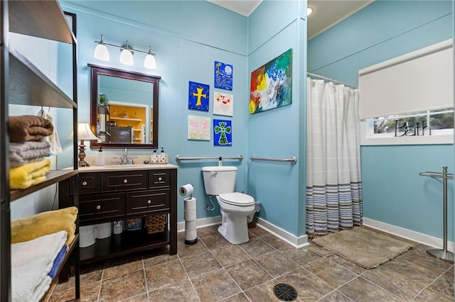 bathroom featuring vanity, toilet, and walk in shower