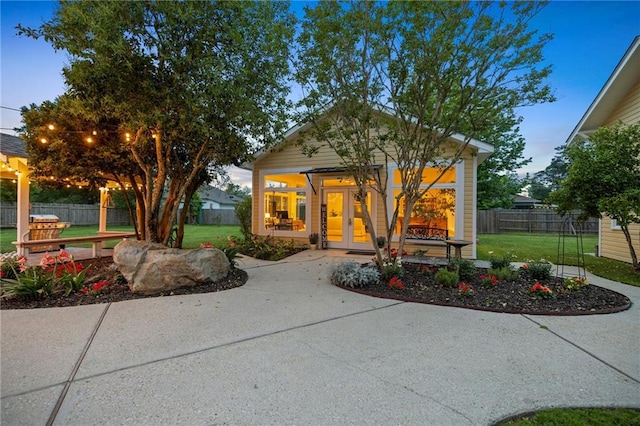 exterior space featuring a lawn and french doors