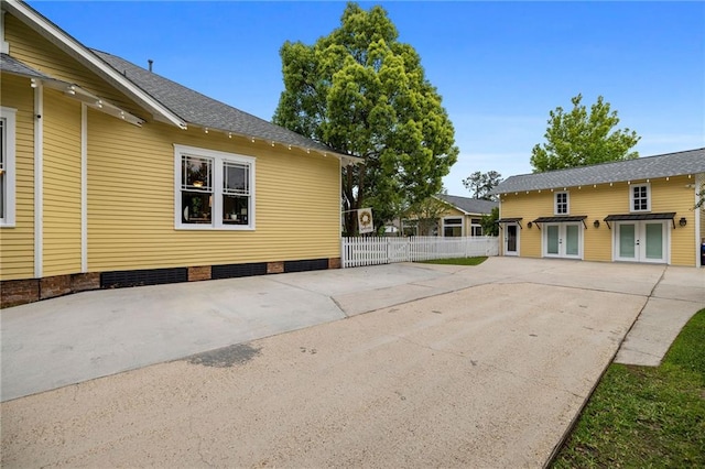 view of side of property with a patio area