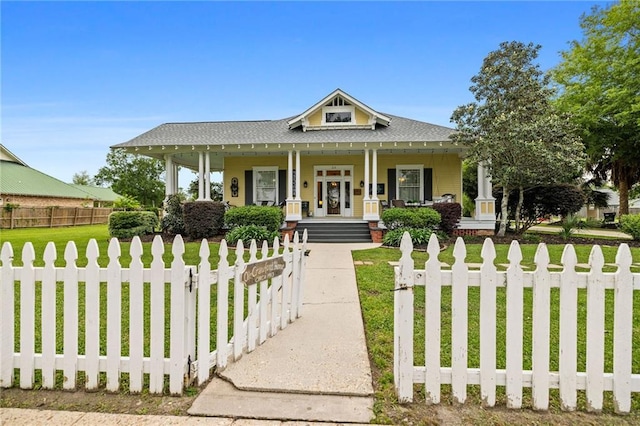 view of front facade with a porch and a front lawn