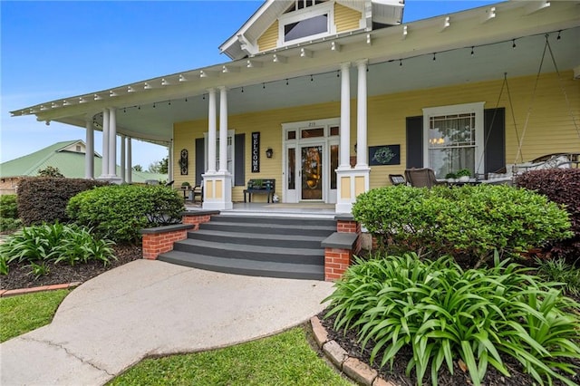 doorway to property with a porch