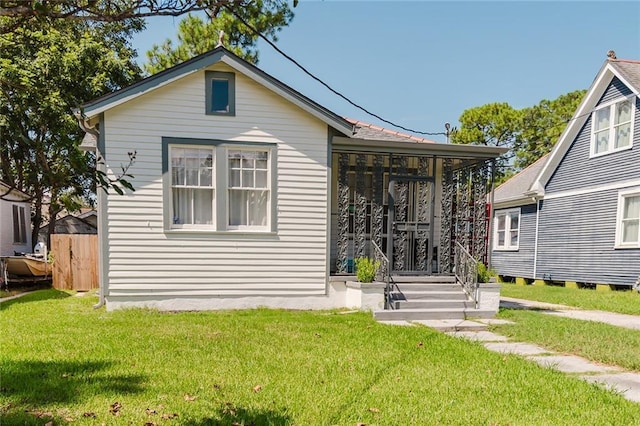 4670 Marigny St, New Orleans, LA 70122 - bungalow-style home with a front lawn