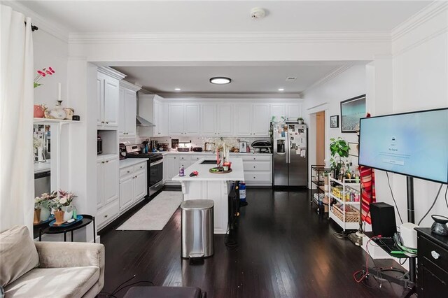 4670 Marigny St, New Orleans, LA 70122 - kitchen featuring appliances with stainless steel finishes, dark wood-style floors, white cabinetry, light countertops, and crown molding