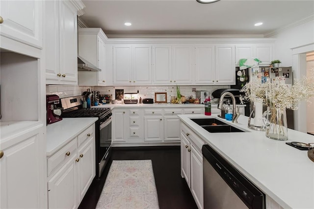 kitchen featuring tasteful backsplash, sink, white cabinets, stainless steel appliances, and ornamental molding