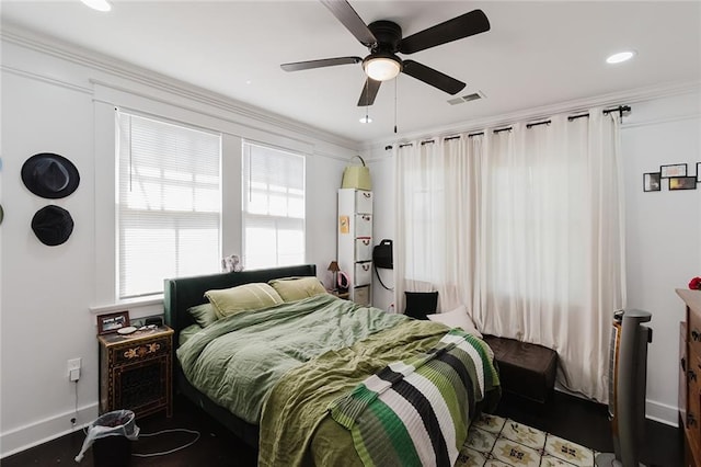 bedroom featuring ceiling fan and ornamental molding