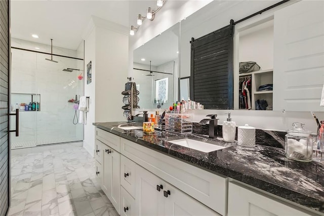 bathroom with vanity and a shower with shower door