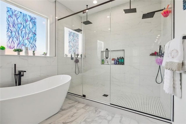 bathroom with independent shower and bath and tile walls