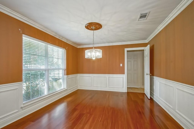 unfurnished dining area with wood-type flooring and ornamental molding