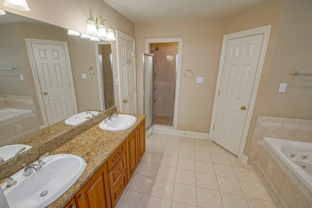 bathroom featuring independent shower and bath, vanity, and tile patterned flooring