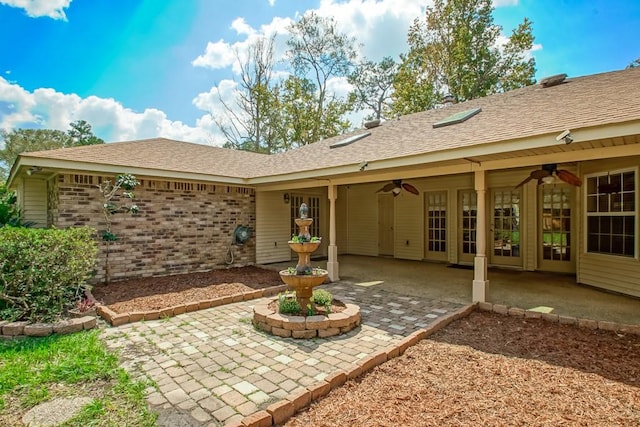 back of house with a patio and ceiling fan