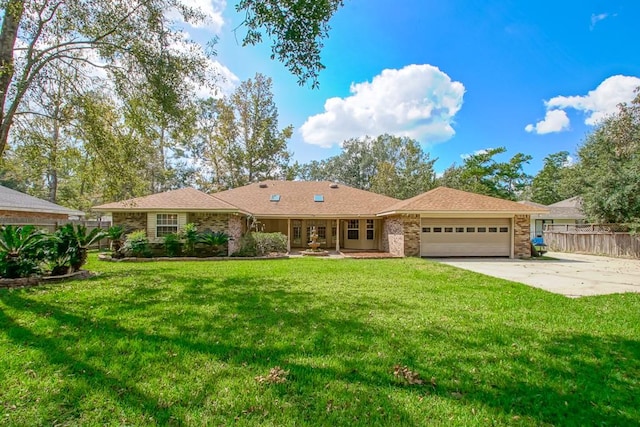 single story home featuring a front yard and a garage