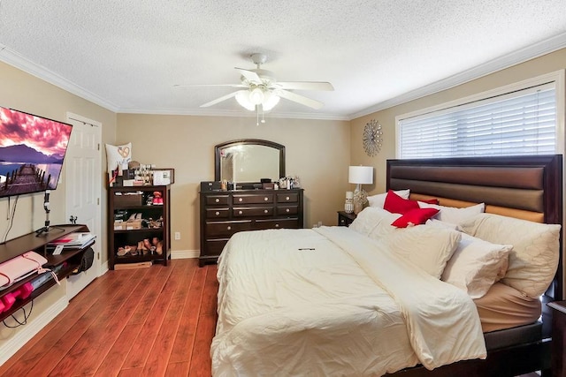 bedroom with ornamental molding, ceiling fan, dark hardwood / wood-style floors, and a textured ceiling