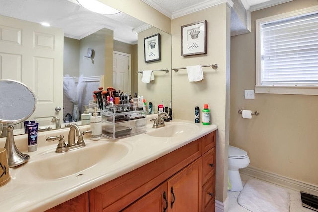 bathroom featuring vanity, crown molding, and toilet