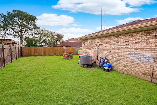 view of yard with central air condition unit