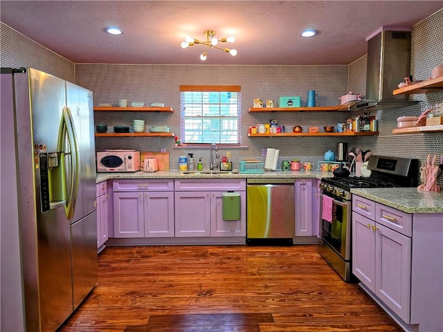 kitchen featuring white cabinets, sink, appliances with stainless steel finishes, dark hardwood / wood-style floors, and light stone countertops