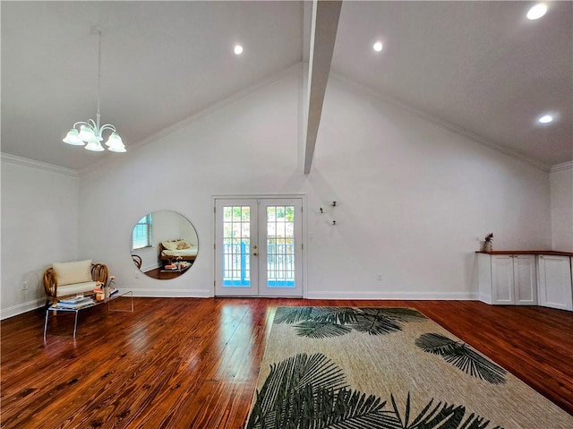 interior space featuring wood-type flooring, a chandelier, beam ceiling, ornamental molding, and french doors