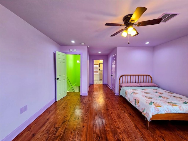 bedroom featuring ceiling fan and dark wood-type flooring