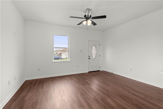 foyer entrance with ceiling fan and dark hardwood / wood-style flooring