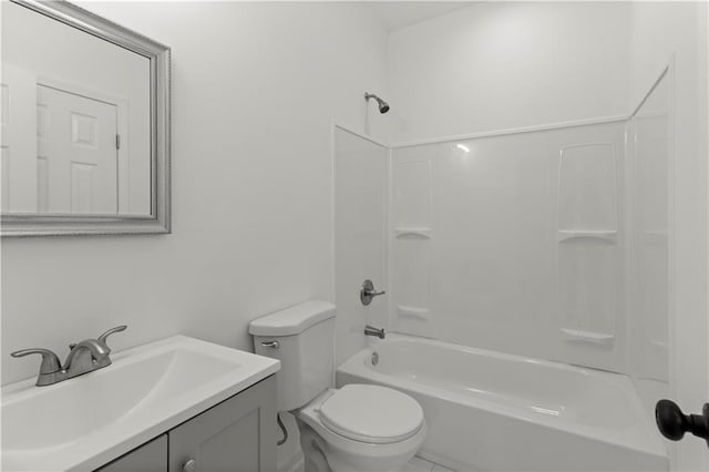 full bathroom featuring shower / bathing tub combination, vanity, and toilet