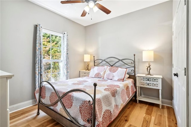 bedroom featuring ceiling fan and hardwood / wood-style floors