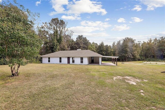 single story home with a patio and a front lawn