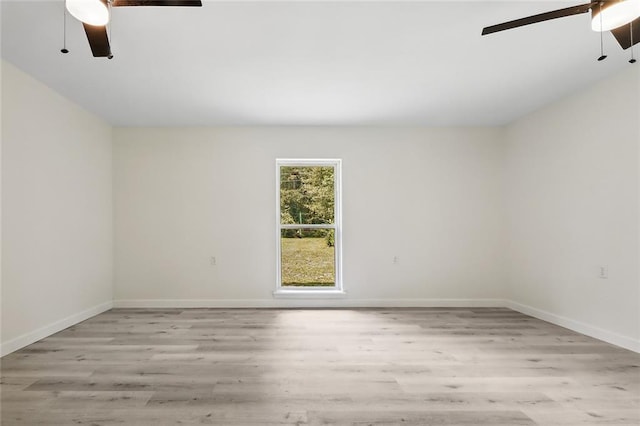 unfurnished room with light hardwood / wood-style floors, ceiling fan, and vaulted ceiling