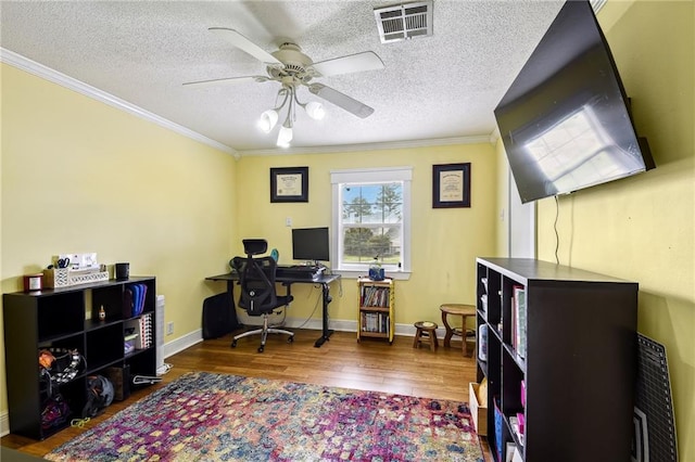 office space with hardwood / wood-style floors, crown molding, and a textured ceiling