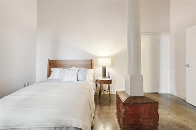 bedroom with concrete flooring