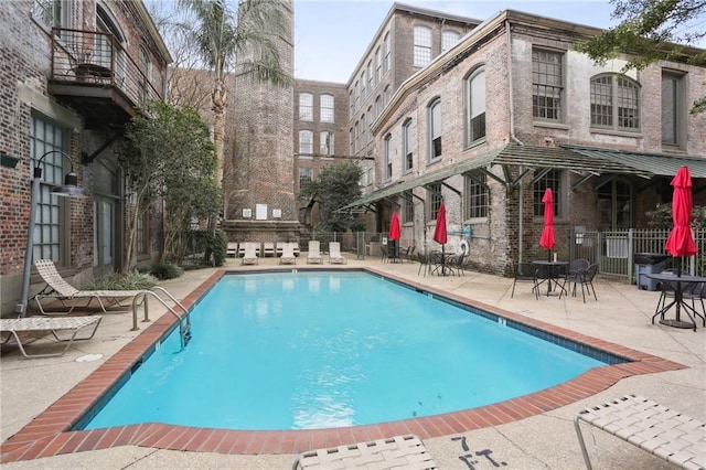 view of swimming pool with a patio