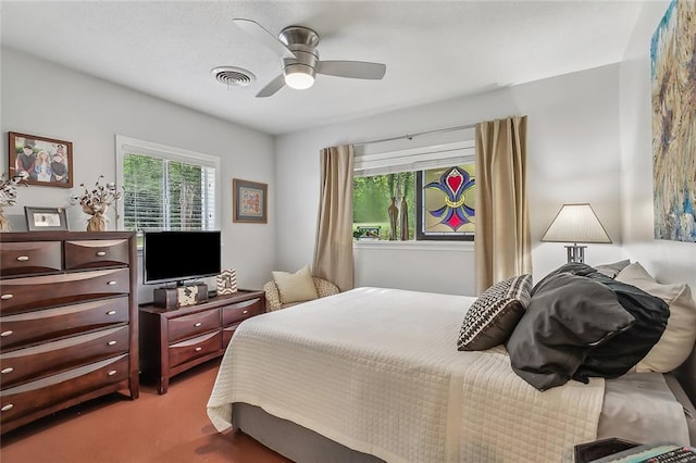 carpeted bedroom featuring ceiling fan