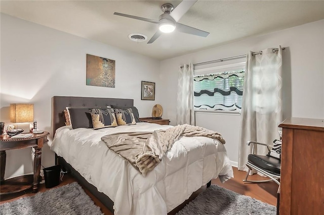 bedroom with hardwood / wood-style floors and ceiling fan