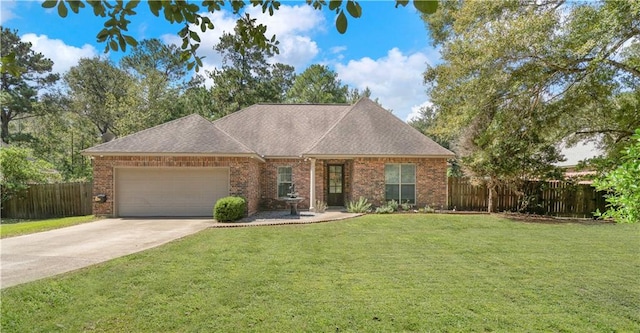 view of front of house with a garage and a front yard