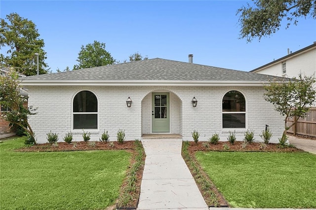 view of front of property with a front lawn