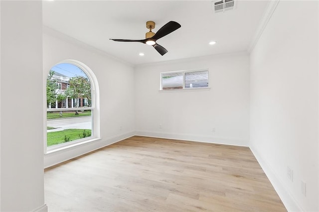 unfurnished room with ornamental molding, ceiling fan, and light hardwood / wood-style flooring