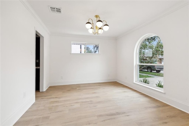 spare room with crown molding, light hardwood / wood-style floors, and plenty of natural light