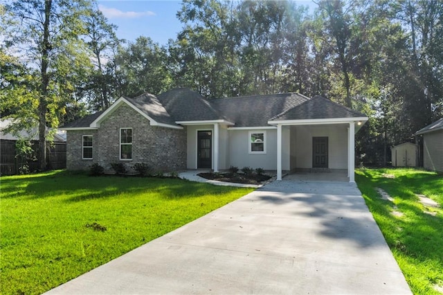 single story home with a carport, a storage unit, and a front yard