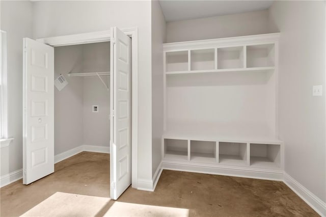 mudroom featuring concrete floors